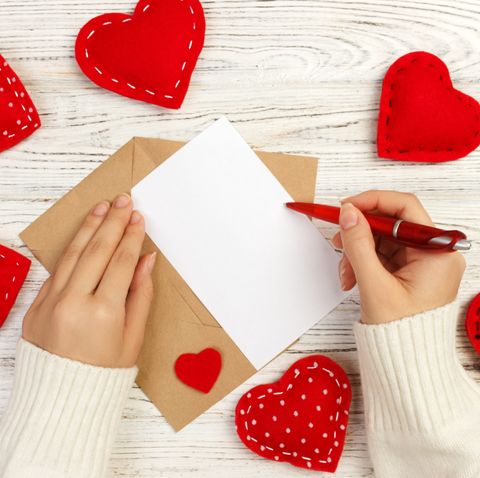 cropped-hands-of-woman-writing-on-paper-at-wooden-royalty-free-image-1576700745