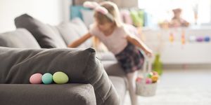 girl-searching-for-easter-eggs-on-sofa-royalty-free-image-1583863715