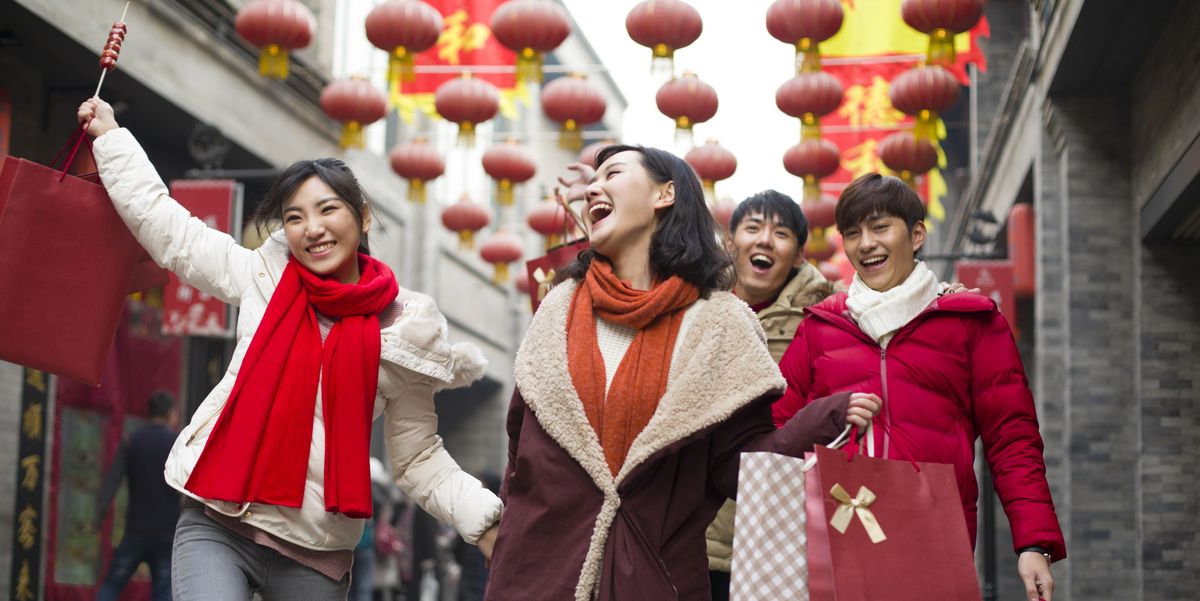 happy-young-friends-shopping-for-chinese-new-year-royalty-free-image-1672247307