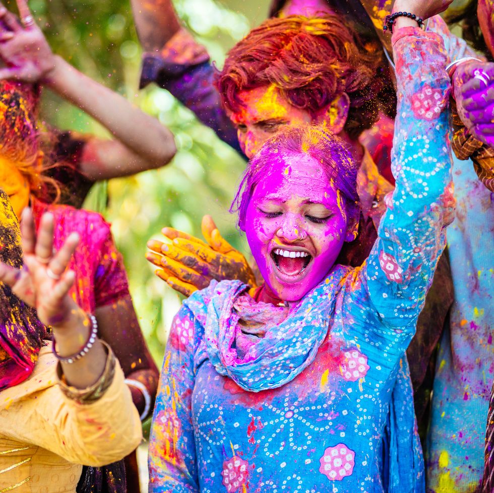 indian-friends-dancing-covered-on-holi-colorful-royalty-free-image-1674160981