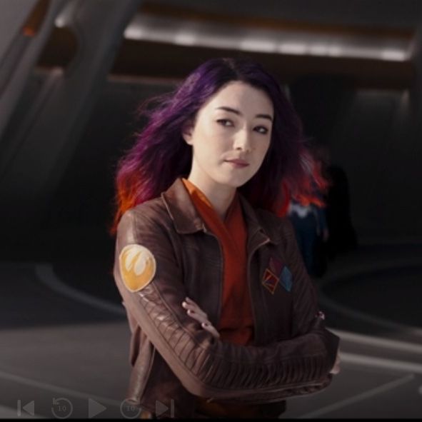 sabine wren's long, multicolored hair blows in the breeze