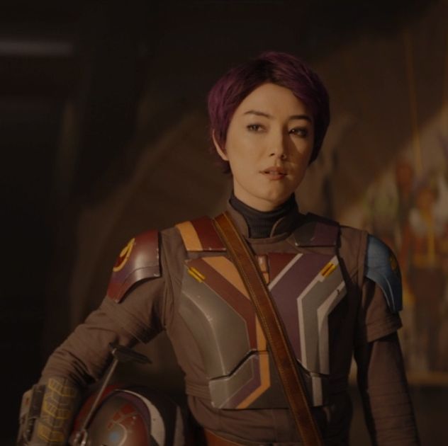 sabine wren, now with short hair, wears mandalorian armor