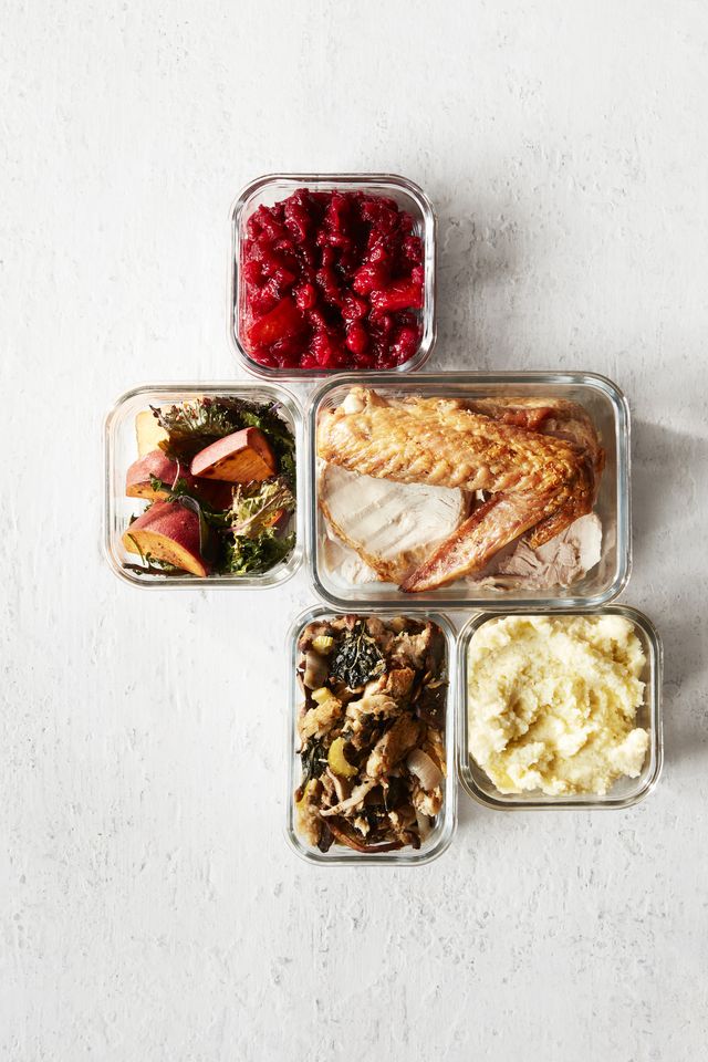 thanksgiving leftovers in containers on white wood