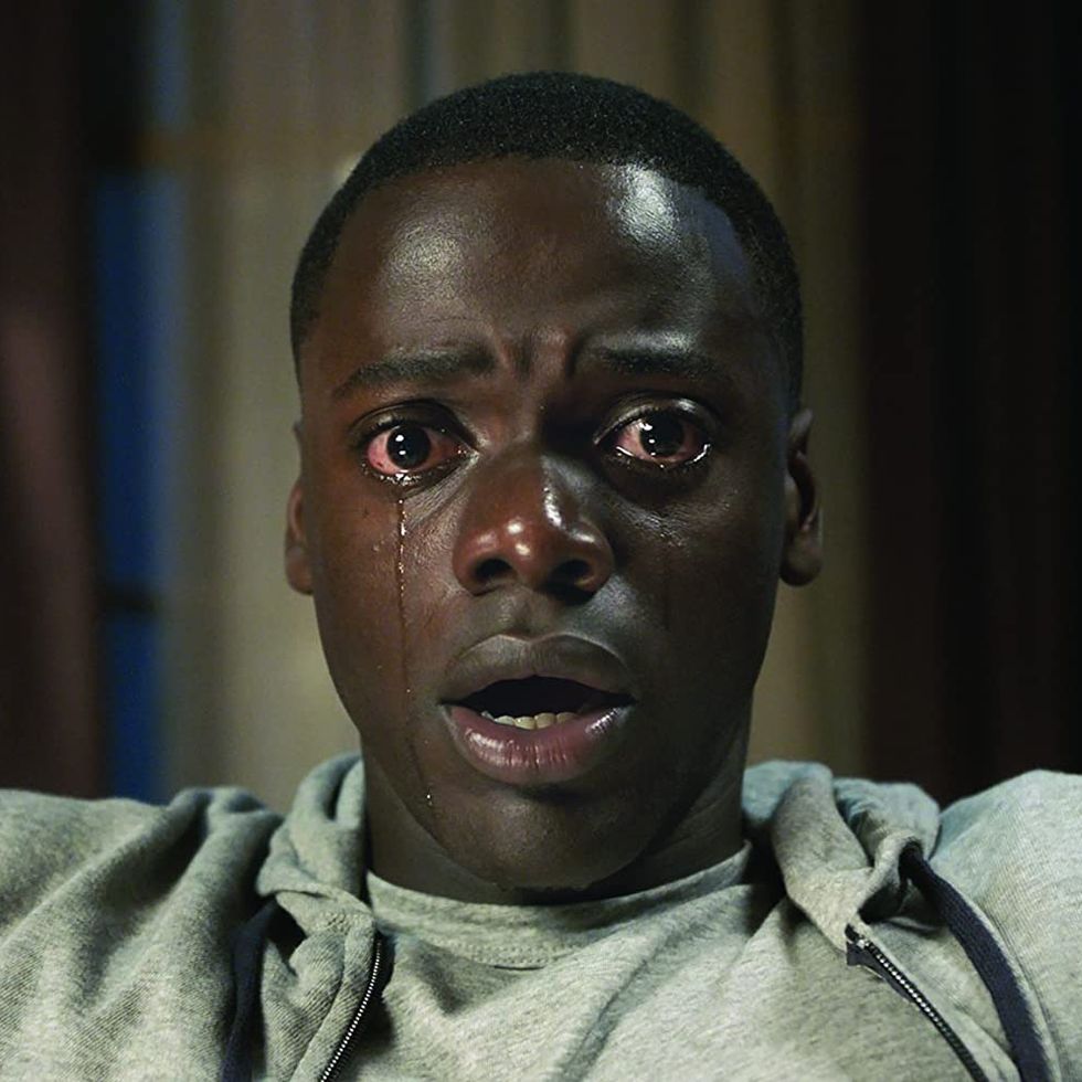 a close up of a crying chris from get out a good housekeeping pick for best halloween movies