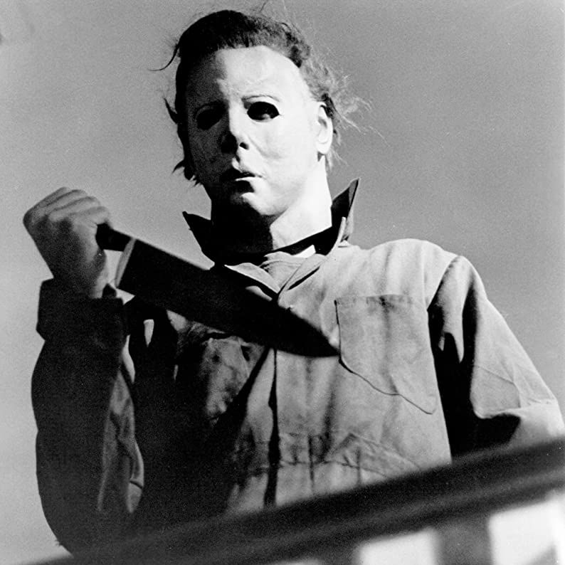 michael meyers holds a knife in a scene from halloween a good housekeeping pick for best halloween movies