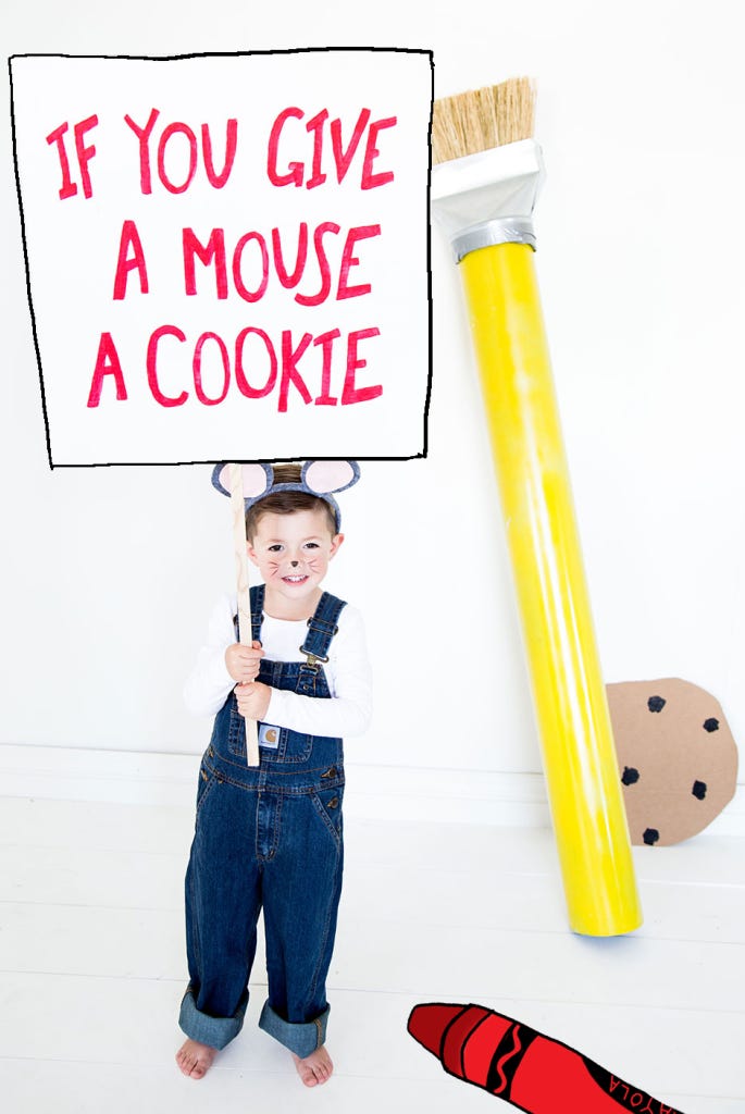 little boy dressed as the mouse from the book if you give a mouse a cookie