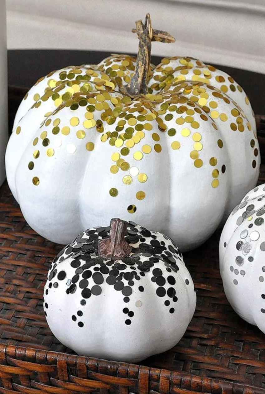 a couple of decorated pumpkins