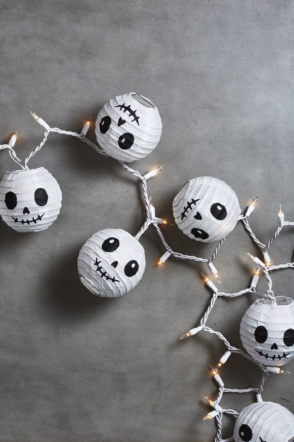 halloween crafts, white lanterns with round skull faces