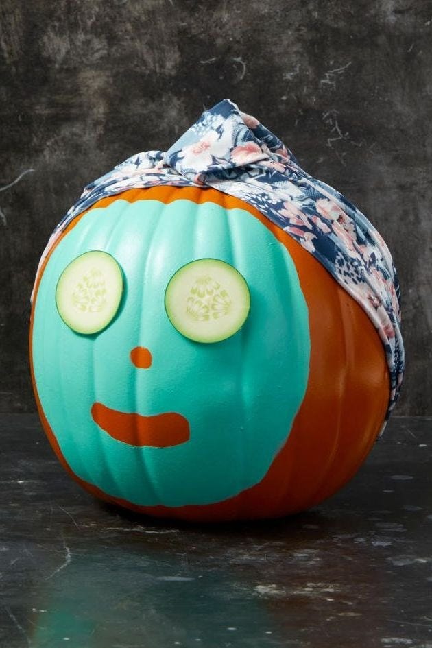 halloween crafts, pumpkin with cucumbers for eyes, mint green paint in the center and a shower cap