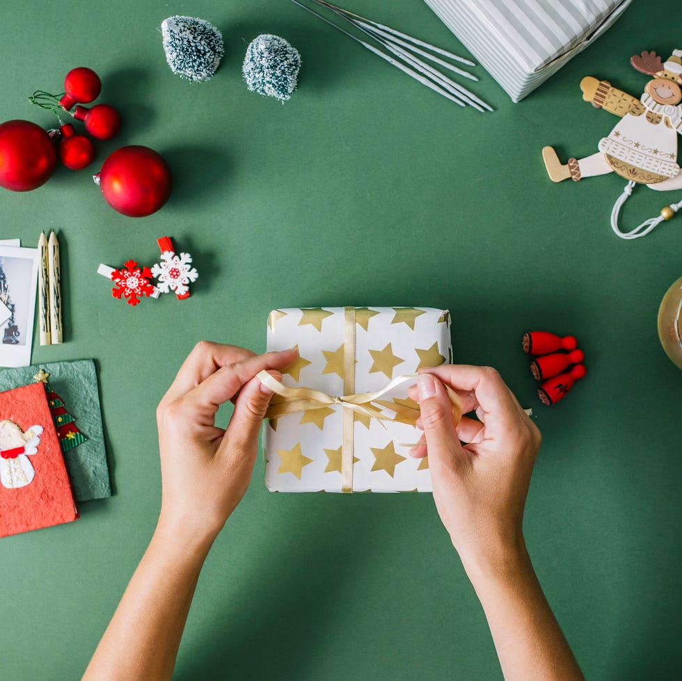 person wrapping a present