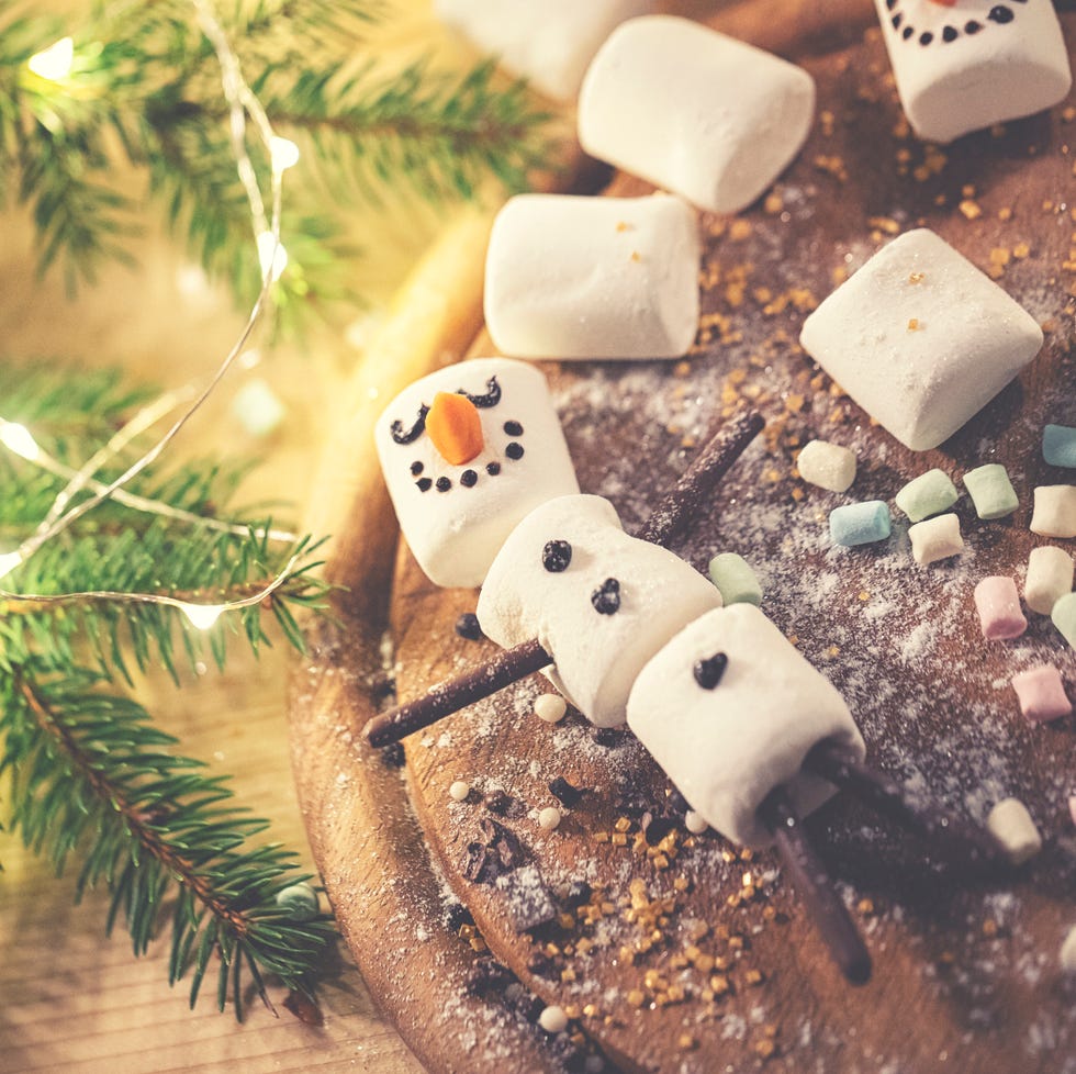 marshmallow snowman laying on a cutting board