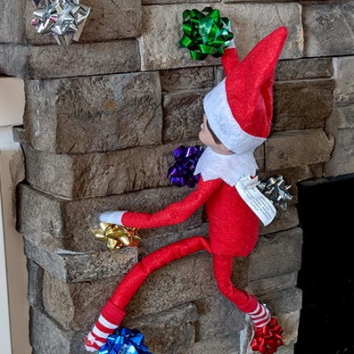 elf on the shelf ideas elf on the shelf scales a rock wall