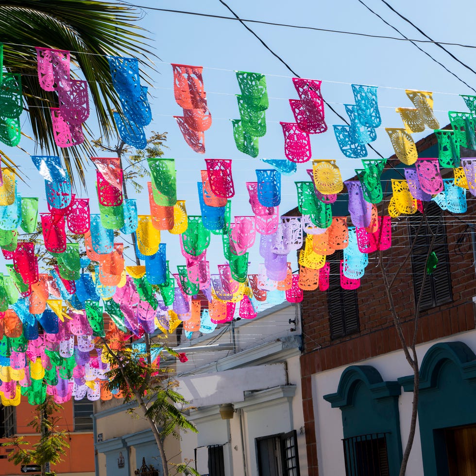 mexico is a colourful country and decorations on the streets are common everywhere and bunting is one of the most popular colourful decorations seen on the streets of mazatlan sinaloa mexico