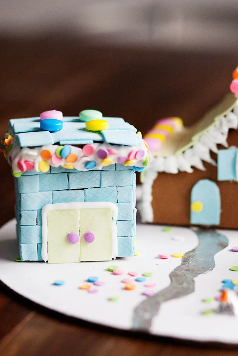 gingerbread house covered with slices of gum and candy