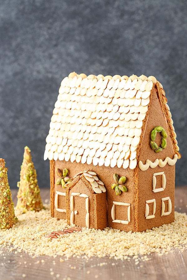 a gingerbread house decorated with nuts