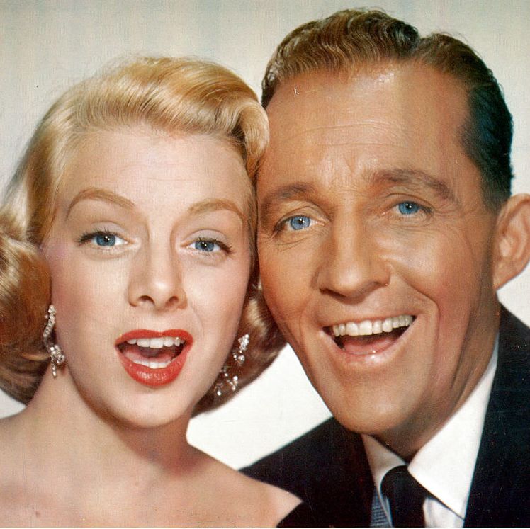 rosemary clooney and bing crosby cheek to cheek in a scene from the film 'white christmas', 1954