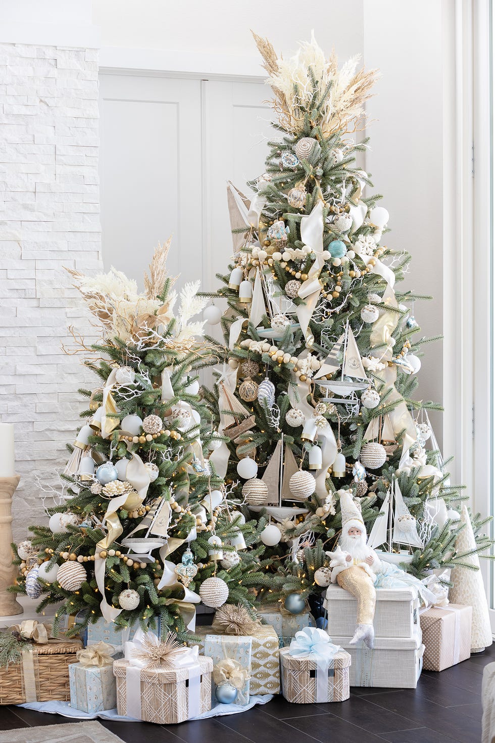 a nautical christmas tree with presents underneath