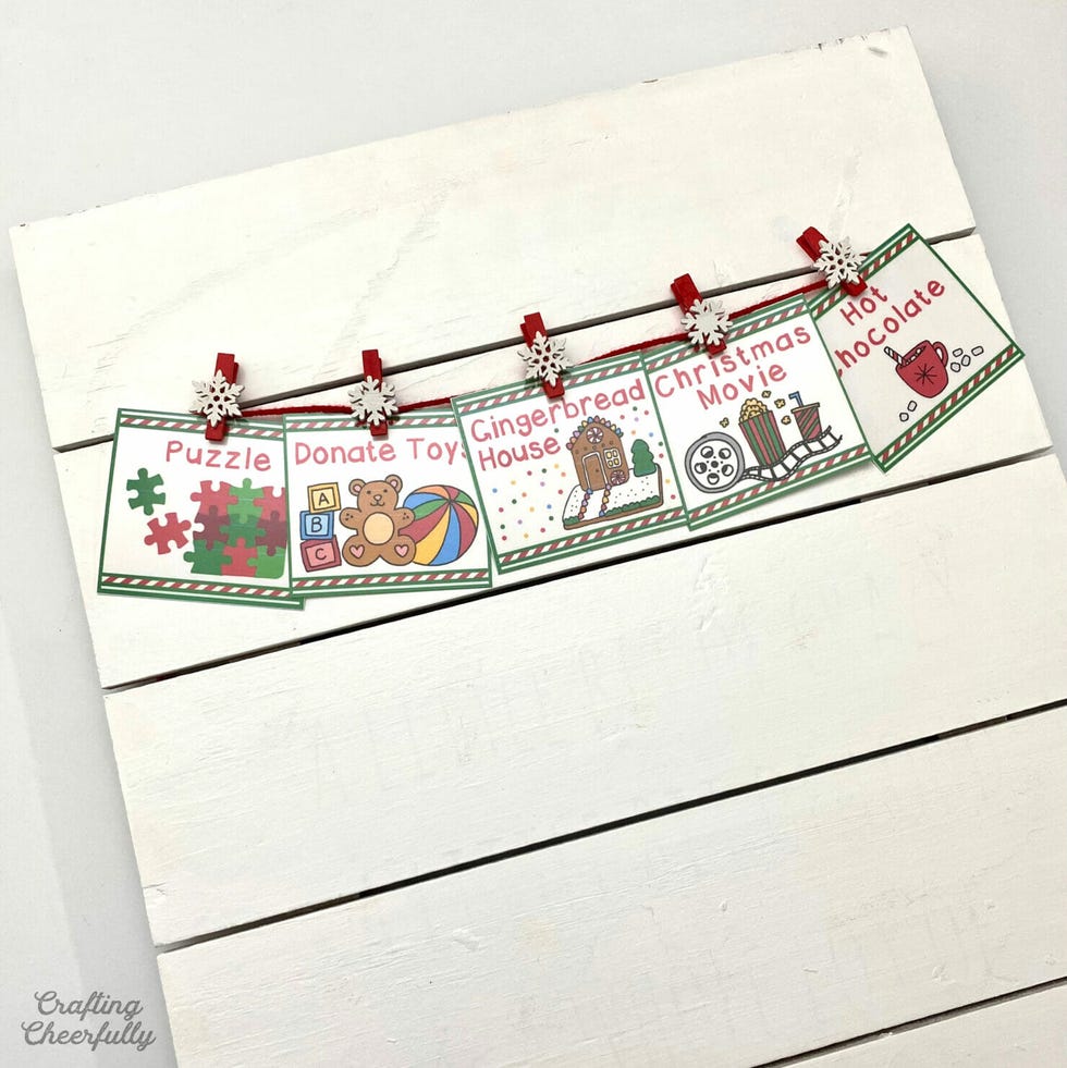 holiday activity cards displayed on a wooden background