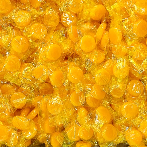 orange gold butterscotch candy pile display