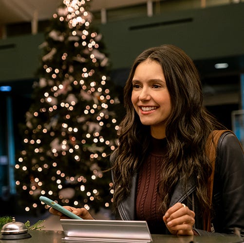 nina dobrev as natalie bauer in a scene from love hard, a good housekeeping pick for best romantic christmas movies