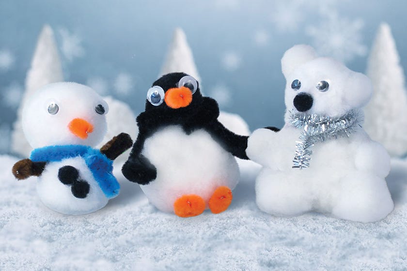 three winterthemed figures made of cotton balls a snowman a penguin and a polar bear