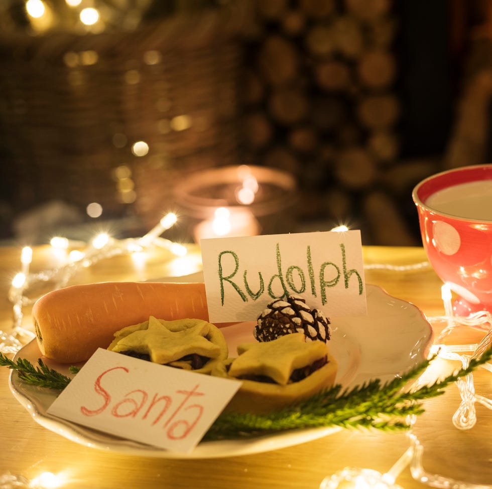 christmas activities closeup of santa claus cookies and a carrot with signs for santa and rudolph