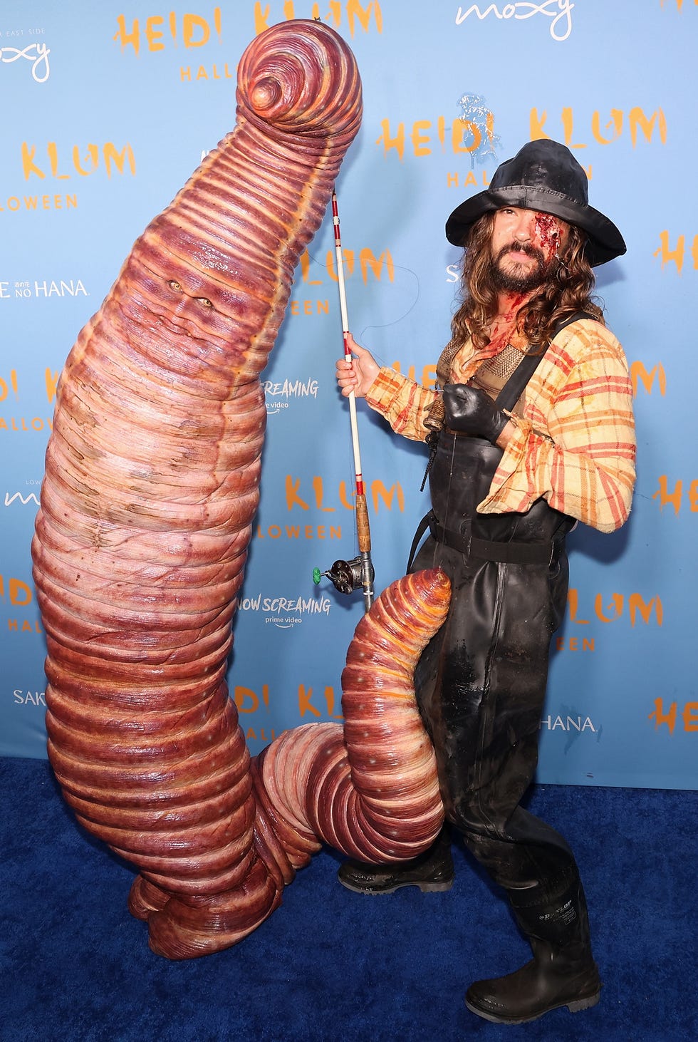 heidi klum's hallowe'en party 2022 dressed as a worm with fisherman husband