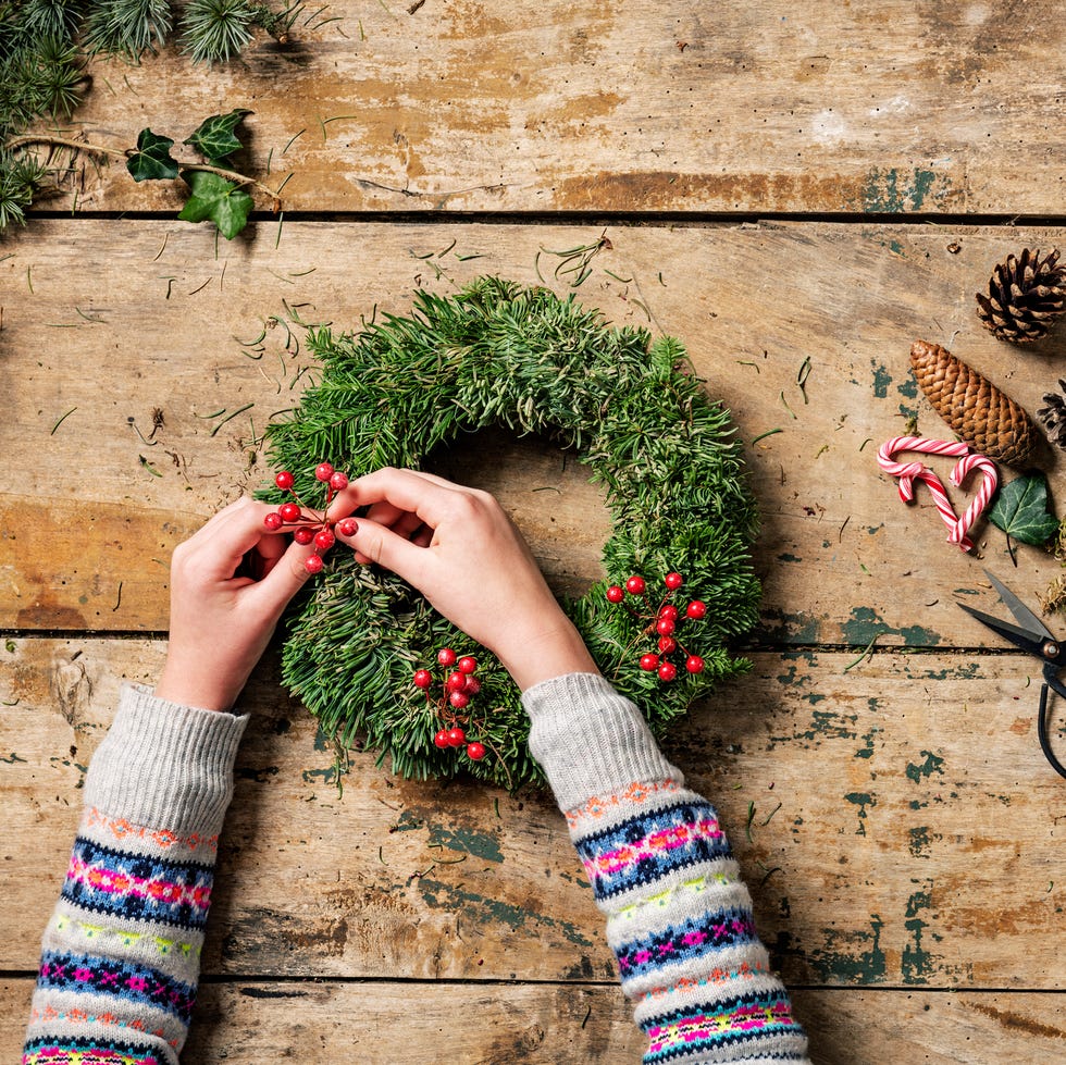 overhead view of christmas wreaths being made