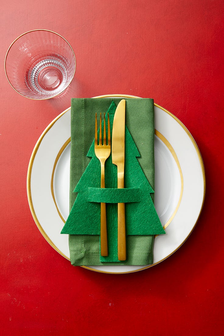 green felt christmas tree place setting on red table