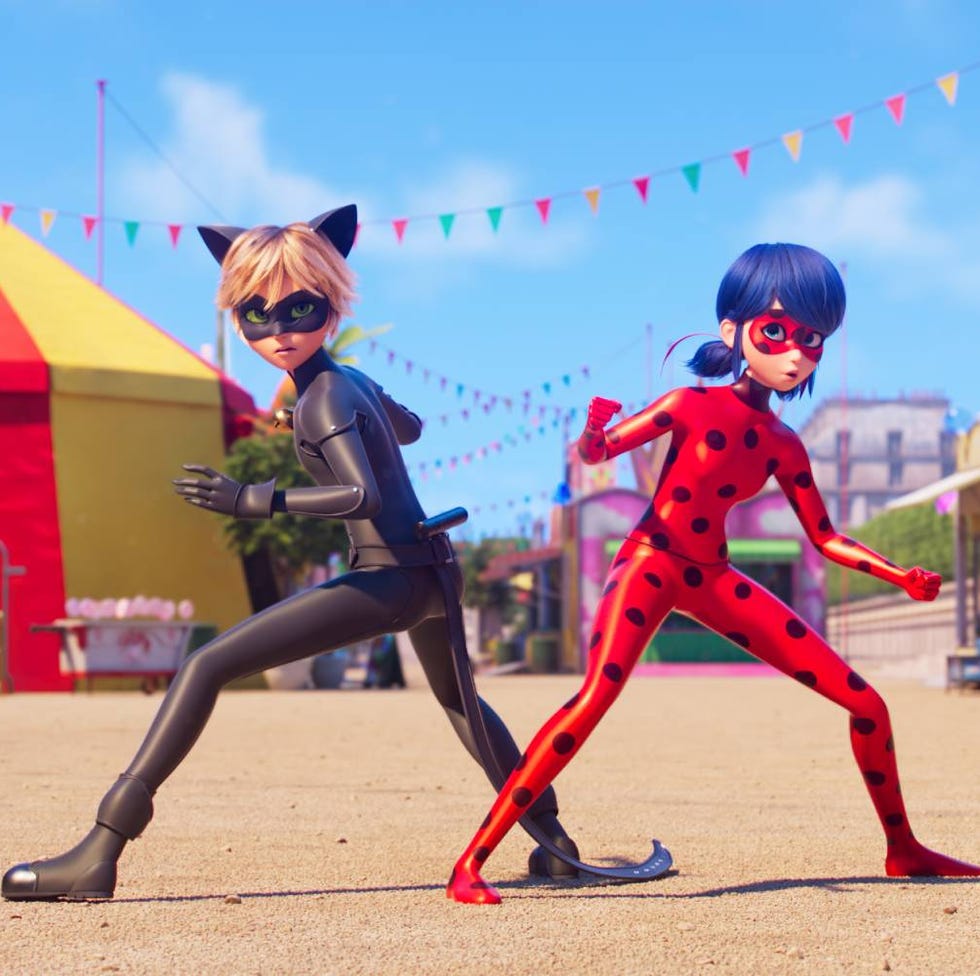 cat noir and miraculous ladybug strike a battle pose in a scene from miraculous ladybug and cat noir the movie, a good housekeeping pick for best kids' movies 2023