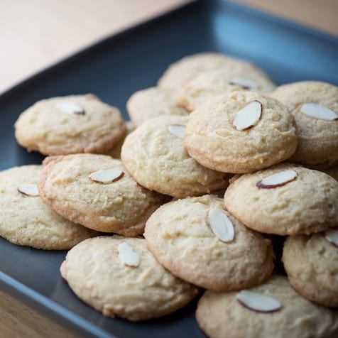 chinese almond cookies stacked on a plate