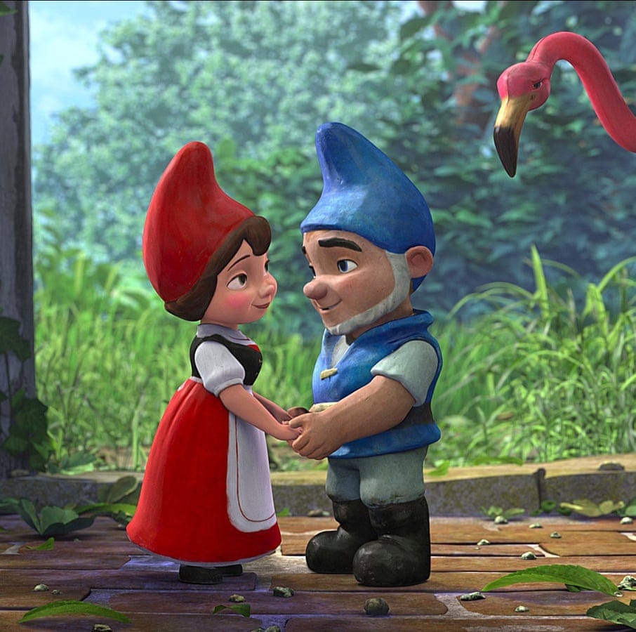 two garden gnomes hold hands in a scene from gnomeo and juliet, a good housekeeping pick for best valentine's day movies for kids