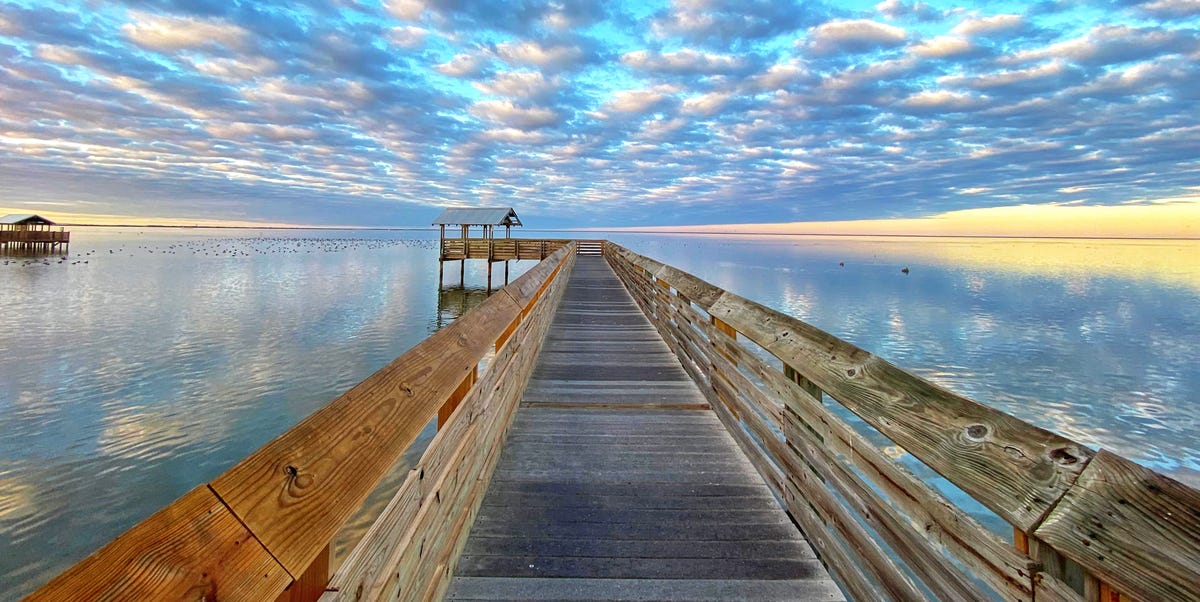 clouds-over-the-south-padre-island-boardwalk-royalty-free-image-1671476548